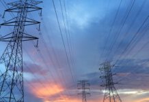 transmission tower under gray sky
