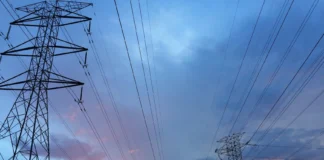 transmission tower under gray sky