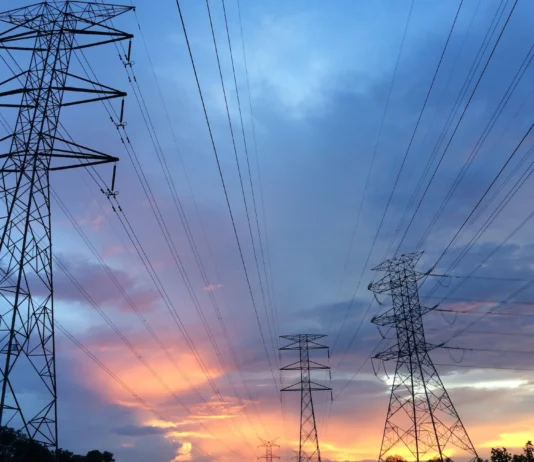 transmission tower under gray sky