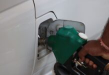 fuel pumping into car at a gas station