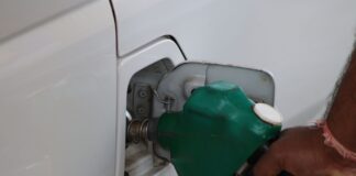 fuel pumping into car at a gas station