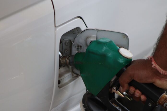 fuel pumping into car at a gas station